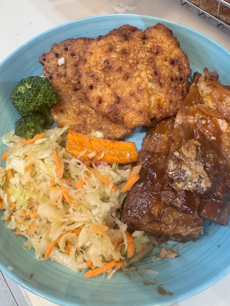 A plate with a breaded pork cutlet and sides